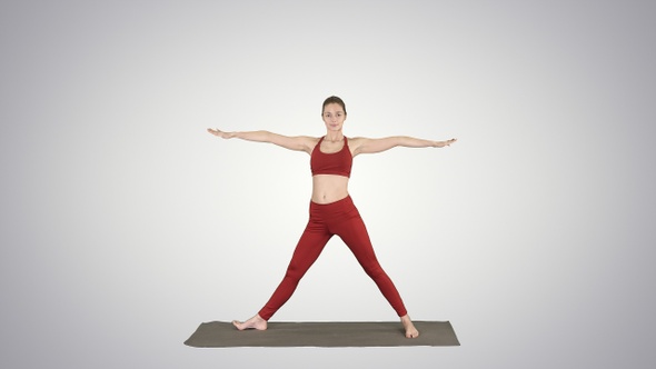 Woman Practicing Yoga Standing in Extended Side Angle