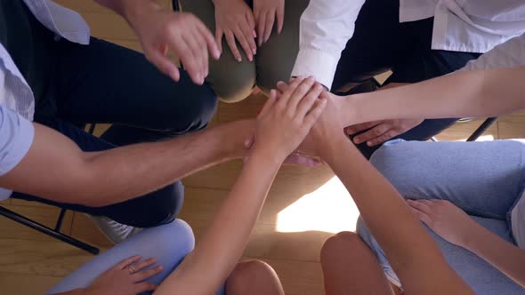 Circle of Trust, People Putting Hands on Top of Each Others Moving Up and Down at Therapy Session