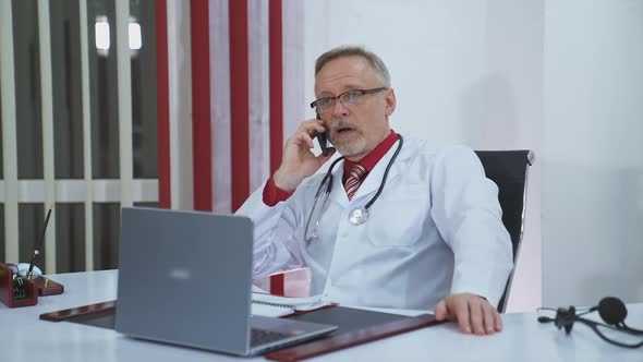 doctor talking on the phone in the office