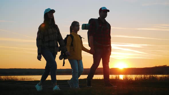 Silhouette of Family at the Coast