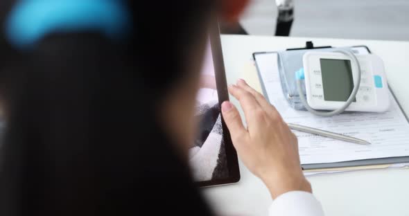 Physician Therapist Consults Sick Patient Via Video Call on Tablet Slow Motion  Movie