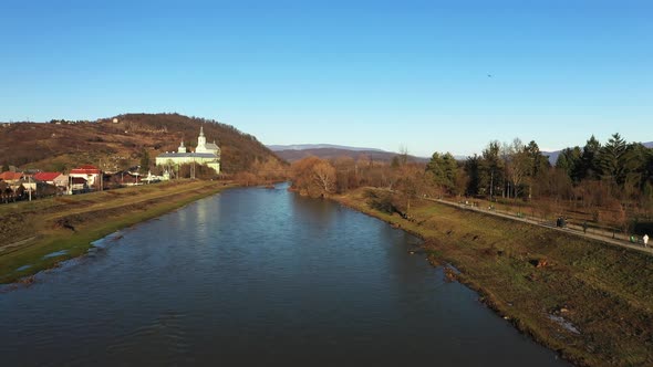 The Mukachevo City Near the River in the Park with Beautiful Mountains Aerial View