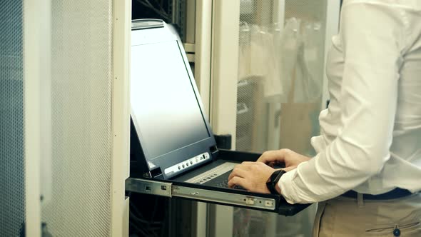 It Administrator In Mining Server Room And Connecting Ethernet Wire. Server Rack System Diagnostic.