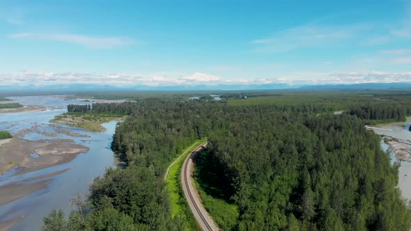 4K Drone Video of Alaska Railroad Train Track with Mt. Denali in Distance during Summer