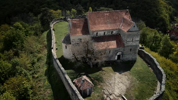 View from drone flying around an old fortified church in Romania