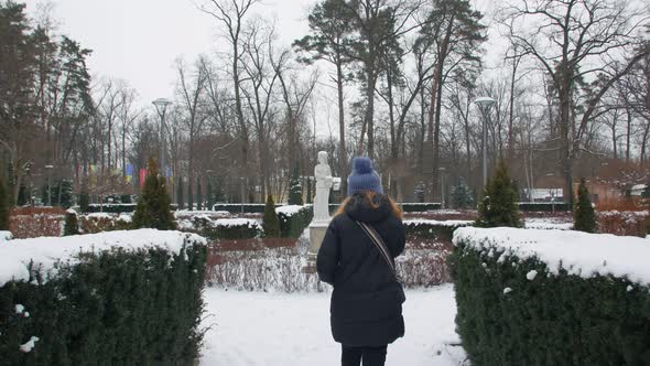 Woman Walking In The Winter Park