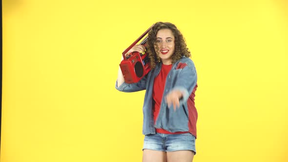 Woman with Red Retro Boombox on Her Shoulder Dancing and Calling To Herself, 80s Party