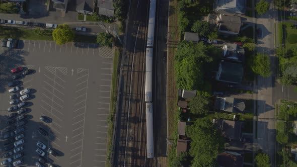 Top Down Aerial View Train Passing Through Port Washington Long Island