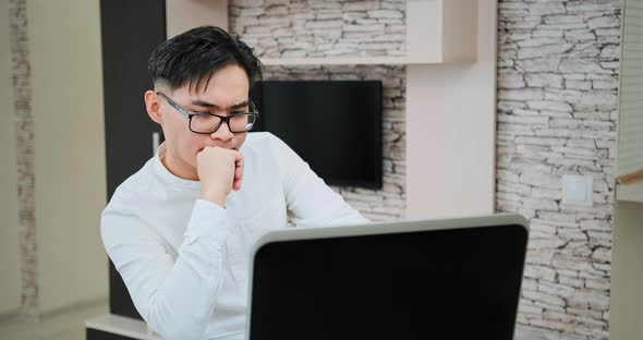 Manager listens to corporate workers at online meeting