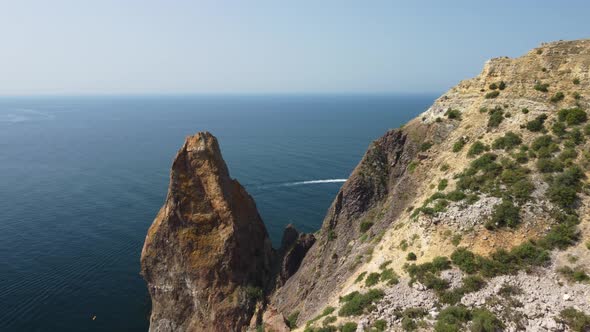 Aerial View From Above on Calm Azure Sea and Volcanic Rocky Shores