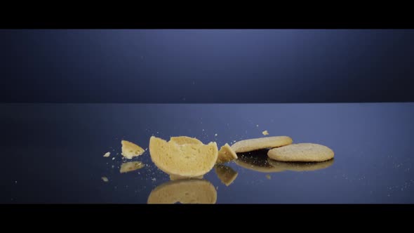 Falling cookies from above onto a reflective surface - COOKIES 184