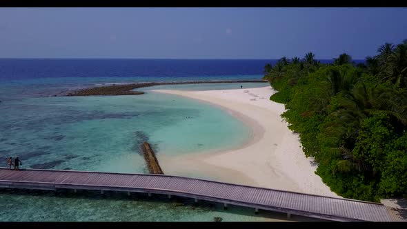 Aerial top down scenery of marine seashore beach voyage by blue lagoon with clean sand background of