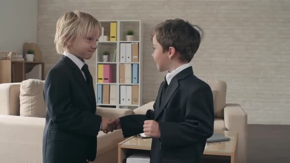 Two Little Businessmen Shaking Hands