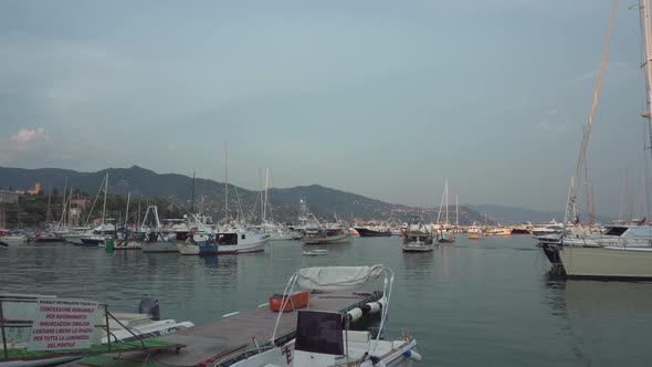 Boats and Yachts at the Mooring in Rapallo at Summer Sunset Italy  2K Editorial Wide Shot Pan