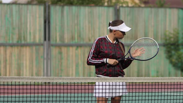 Seductive Confident Woman Playing Tennis on Court