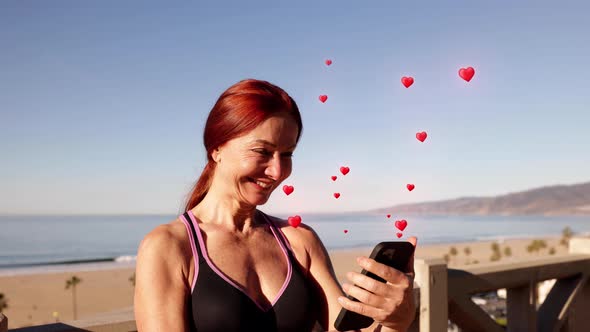 Mature Woman Exercising At The  Beach