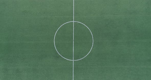 Aerial view of green football, soccer pitch. Top down view on a green, empty soccer field