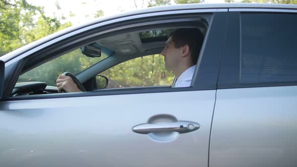 Confident Driver Driving Car on Rural Road