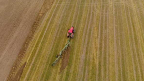 Tractor Moves Through Field with Plow in Transport Position