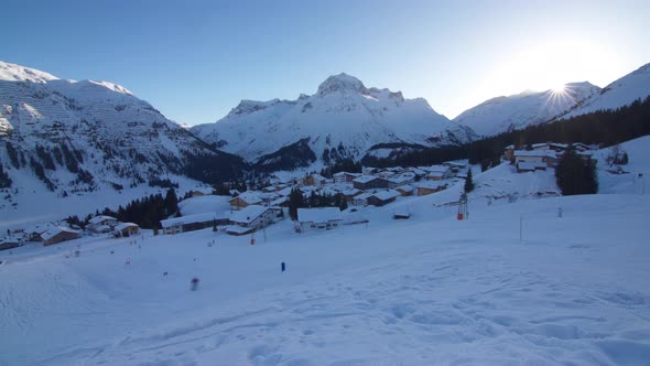 A timelapse of a mountain and ski resort dusk to night