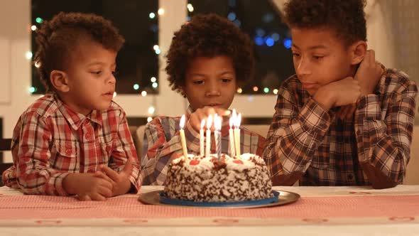 Boy Count Candles on the Cake.
