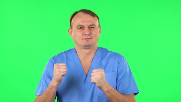 Medical Man Is Dancing Funny, Rejoices. Green Screen