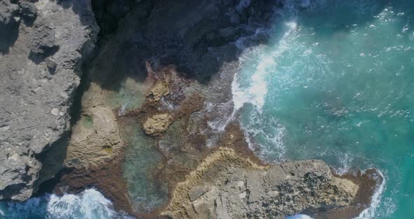 Wonderful view of the sea between the rocks in Macao, watching the splendor of the waves breaking on