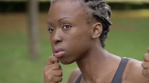 pensive lonely young american african woman in the park