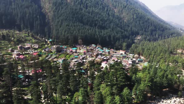 Kasol remote rural village in india Himalaya Parvati valley mountains aerial view of green natural f