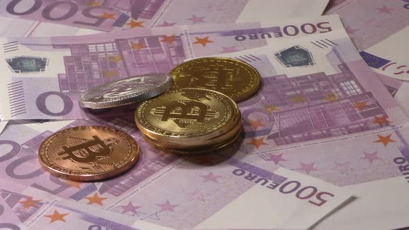 Bit Coin BTC Coins Rotating on Bills of 500 Euro Banknotes. Worldwide Virtual Internet