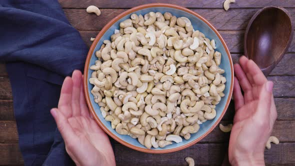 Removing Bowl of Cashews From Table