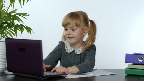 Online Learning, Distance Education, Lesson at Home. Girl Doing School Program Online on Computer