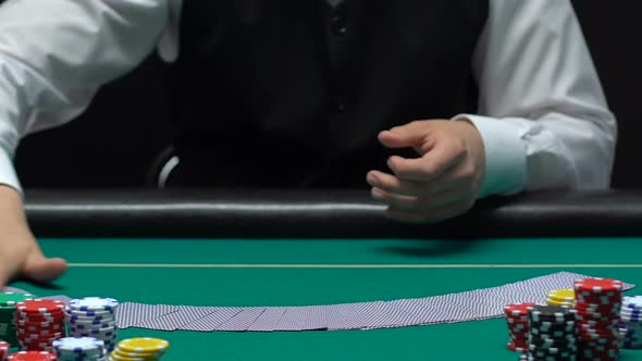 Skillful Casino Dealer Spreading Deck Cards and Turning Up on Table, Occupation