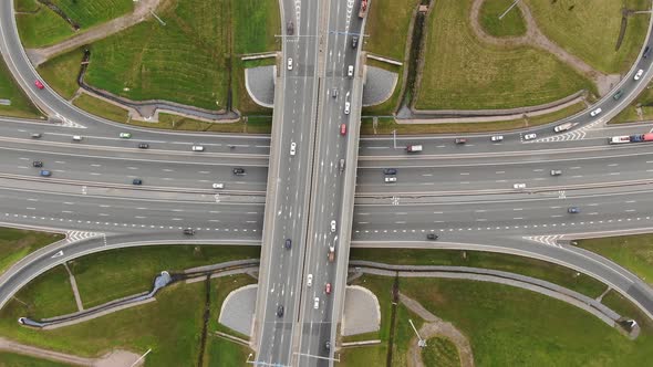 Automobiles Drive at High Speed Along Multilevel Highway