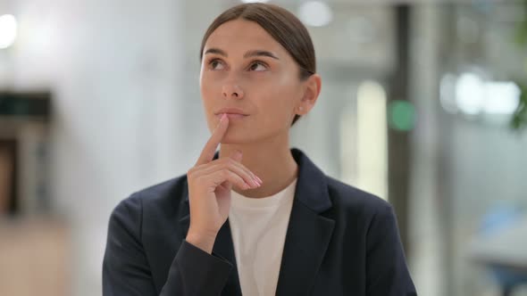 Portrait of Pensive Businesswoman Thinking About Something 