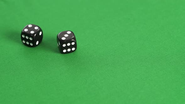 Double Dice Game on Green Casino Table. Player Throwing Double Dice Four and Three on Gaming Table