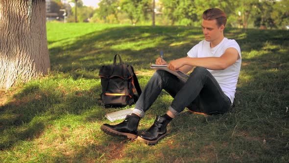 Guy Studying Outdoors