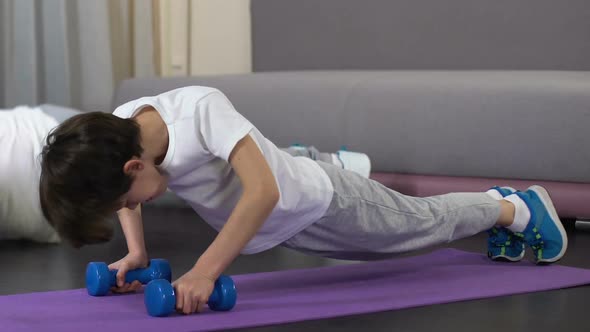 Father Teaching Son to Do Push-Up Exercise, Healthy Lifestyle From Childhood