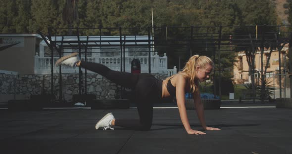 Athlete Exercising Hips In Outdoor Gym