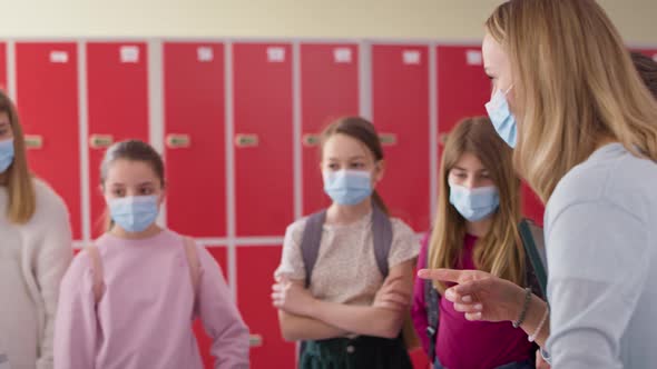 Video of teacher and children talking in the school corridor. Shot with RED helium camera in 8K.