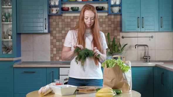 woman cuts fennel in the kitchen for a vegetable salad