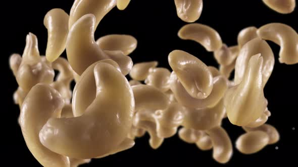 Flying of Cashews in Black Background