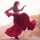 Magnificent Redhead Magic Woman Dancing in a Long Red Skirt on the Edge of the Mountains Golden - VideoHive Item for Sale