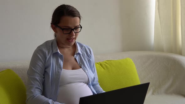 Successful Hardworking Pregnant Business Woman With Laptop and Noutbook