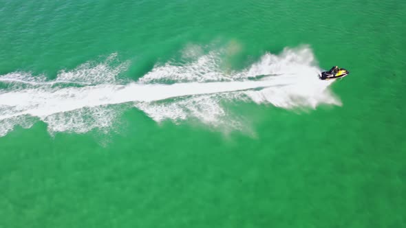 Aerial of Jet Ski Driving on the Atlantic Ocean in Dwoning County Donegal  Ireland