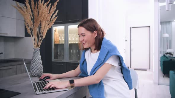 Overjoyed Girl Student Celebrate Victory in Online Game Using Laptop Feel Amazed Sit at Home, Happy