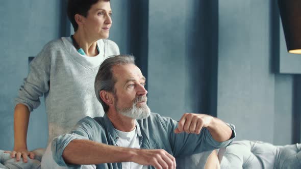 Aged Couple Sitting on the Couch