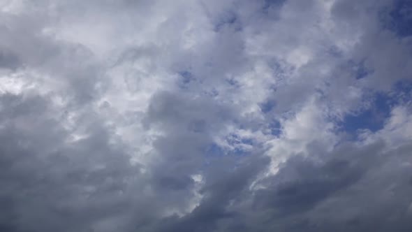 Blue Sky Changes, Dark Gray Rain Clouds Tighten. Time Lapse