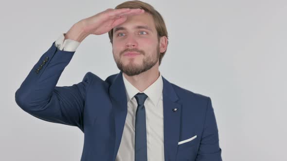 Young Businessman Looking Around Searching White Screen