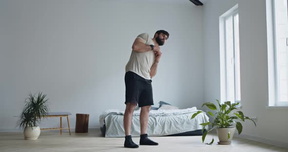 Young Man Working Out at Home Interior